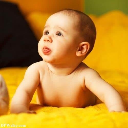 a baby laying on a yellow blanket cute dp photos 