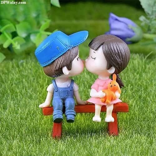 cute dp - a couple sitting on a bench in the grass