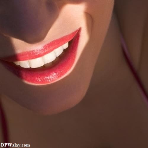 smile dp - a woman with a red lipstick and a white smile