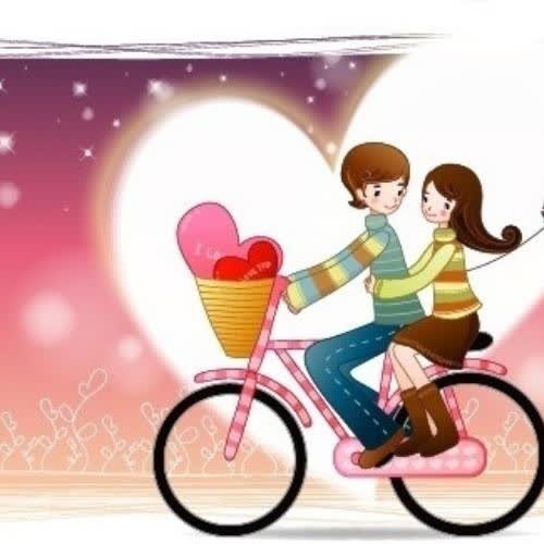 a couple riding a bike with a heart shaped balloon 
