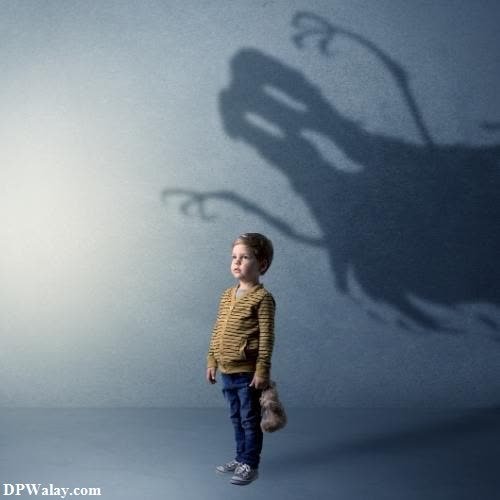 a little boy standing in front of a shadow of a horse