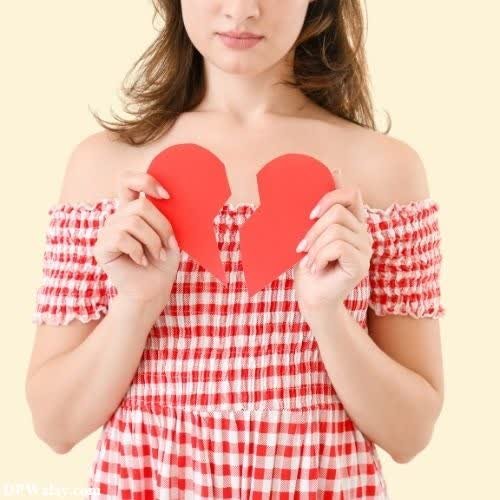 breakup dp - a young girl holding a red heart
