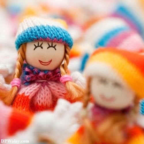 a small doll sitting in a pile of colorful yarn images by DPwalay