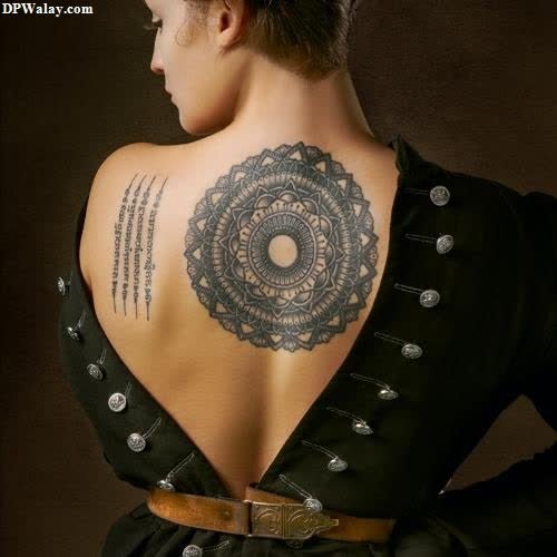 a woman with a tattoo on her back-Pebz 