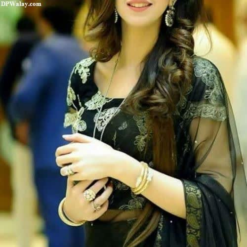 a beautiful young woman in a black sari dp for whatsapp hidden face