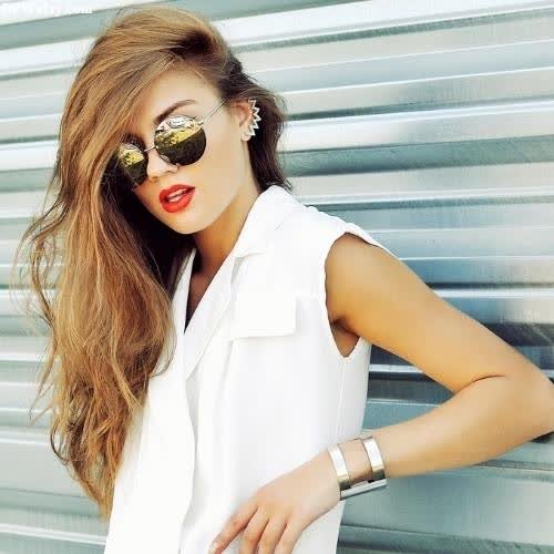a woman in white shirt and sunglasses leaning against a wall dp for whatsapp unique 