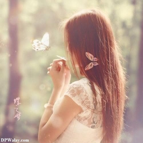 a girl with long hair and a butterfly in her hand images by DPwalay