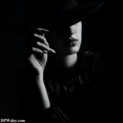 girls dp - a woman in a hat smoking a cigarette