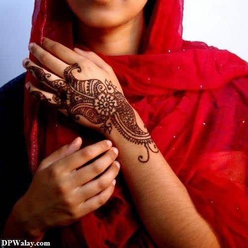a woman with hennap on her hand dp hidden face 