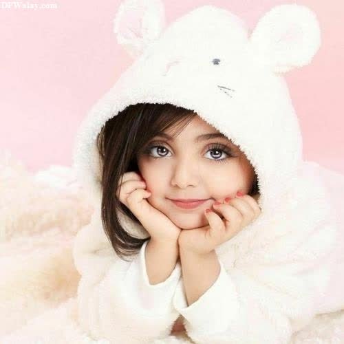 a little girl wearing a white bear costume images by DPwalay