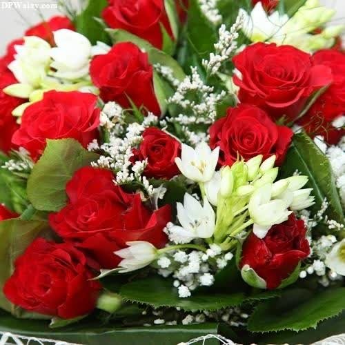 a bouquet of red roses and white lilies images by DPwalay