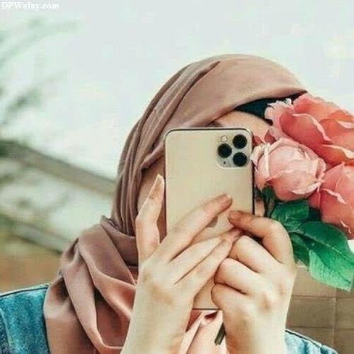 a woman taking a picture of flowers face hidden dps