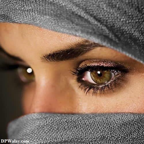 a woman with a veil covering her eyes
