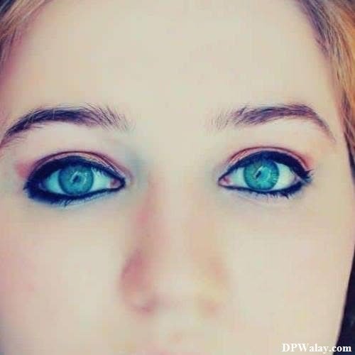 a woman with blue eyes and long hair-PXhh