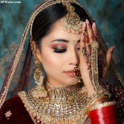 a beautiful bride in a red and gold lera