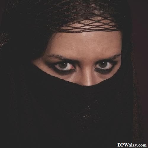 a woman with a veil covering her face