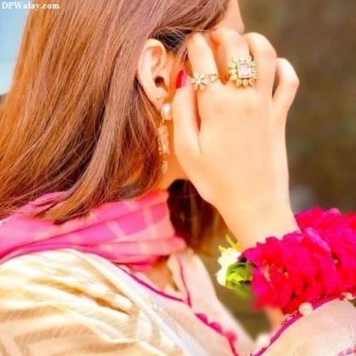 a woman with a flower in her hand girls dp new 