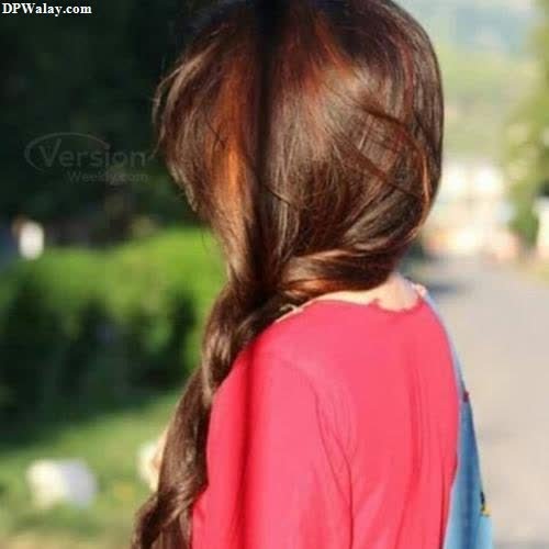 a girl with long hair and a red shirt