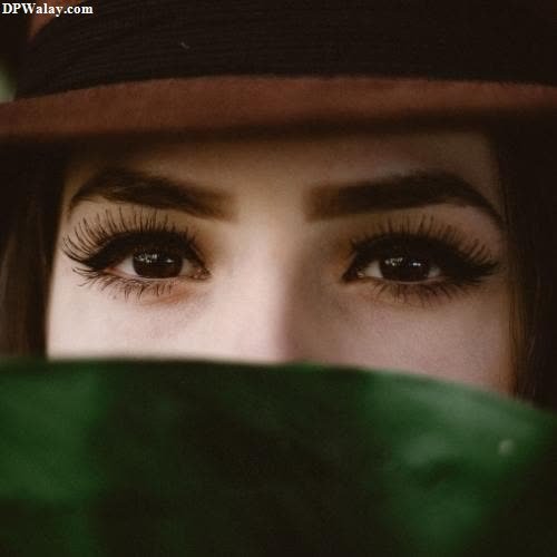 a woman with long eyelashes and a hat eye girls dp