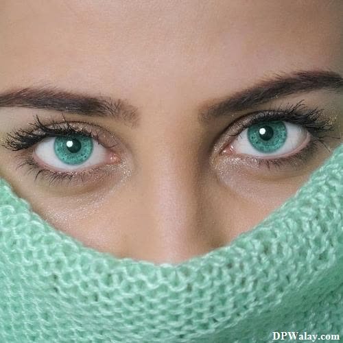 a woman with green eyes and a scarf eye girls dp
