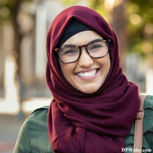 a woman wearing a maroon scarf and glasses