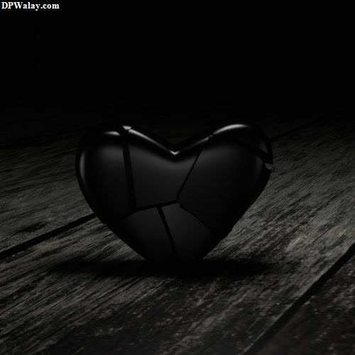 a broken heart on a wooden floor
