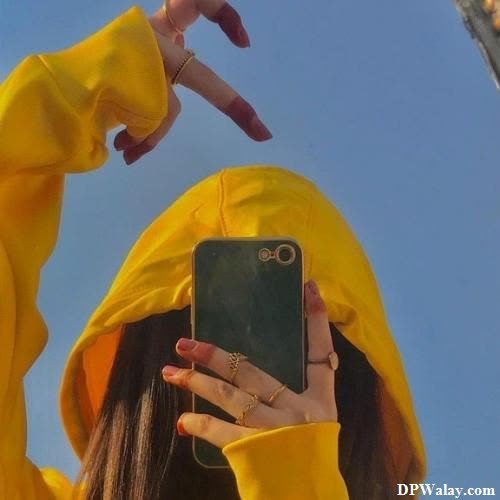 a woman in yellow raincoat taking a self self self self self self self self self self self hidden face dp 