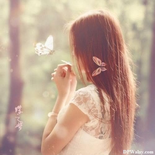 a girl with long hair and a butterfly in her hand hidden face dp for whatsapp