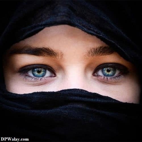 a woman with blue eyes and a black scarf hidden face girls dp