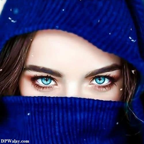 a woman with blue eyes and a blue scarf