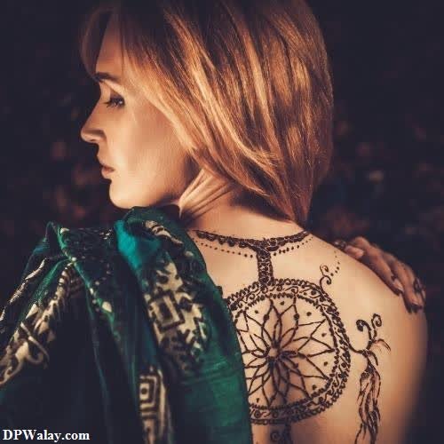 a woman with a tattoo on her back hide face dp 