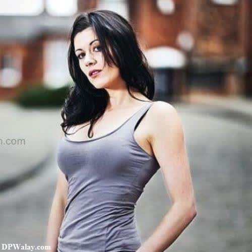 a woman in a gray tank top standing on a street hot couple dp for whatsapp
