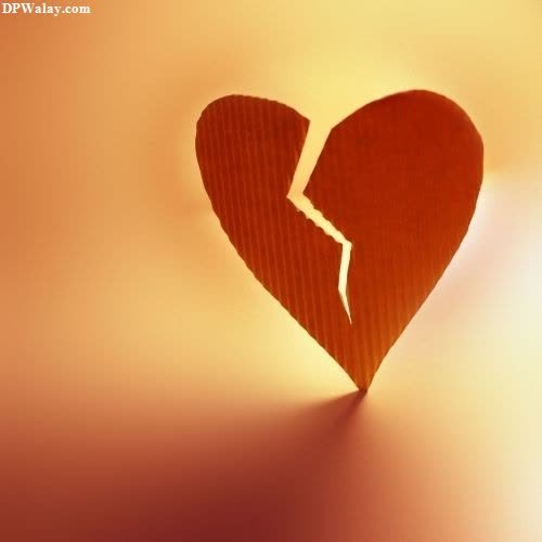 a broken heart on a yellow background
