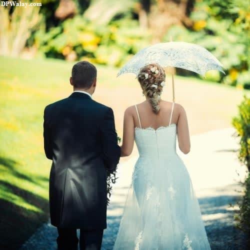 a bride and groom walking down a path instagram dp love