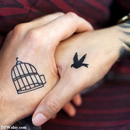 a man with a bird tattoo on his hand