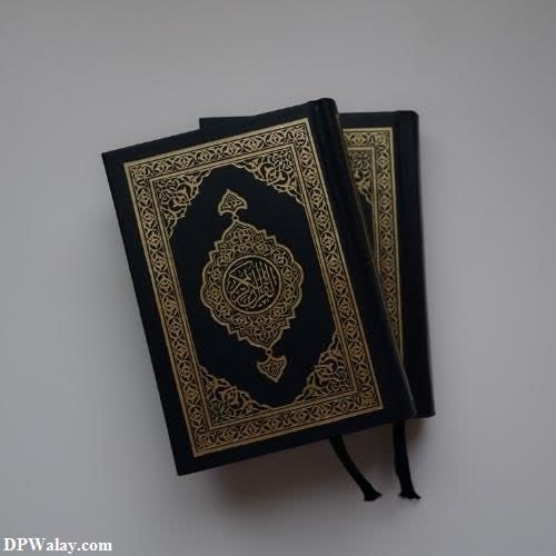 a black and gold quran with a gold design images by DPwalay