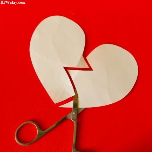 a pair of scissors cutting a heart shape-SeD0 love breakup dp