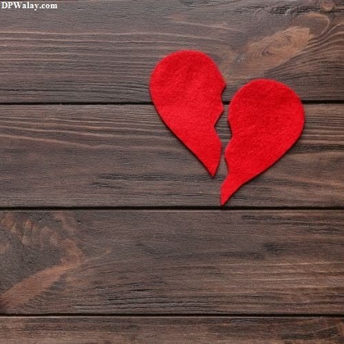breakup dp - two red hearts on a wooden background