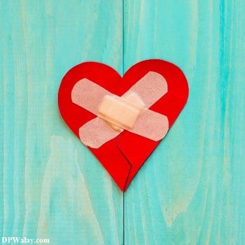 a broken heart with bandages on it-gLZi