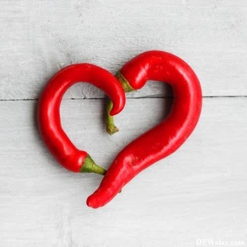 a red hot pepper with a heart shaped chili