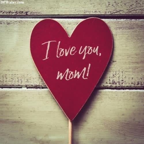 a red heart with the words i love you on it mom dad dp for whatsapp