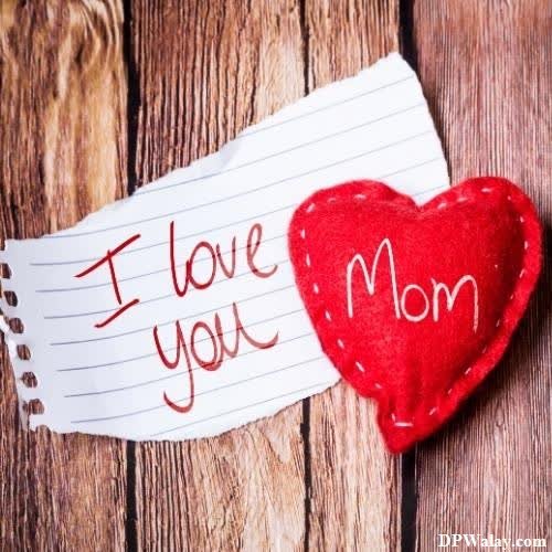 a heart with the words i love you mom written on it mom dad images dp