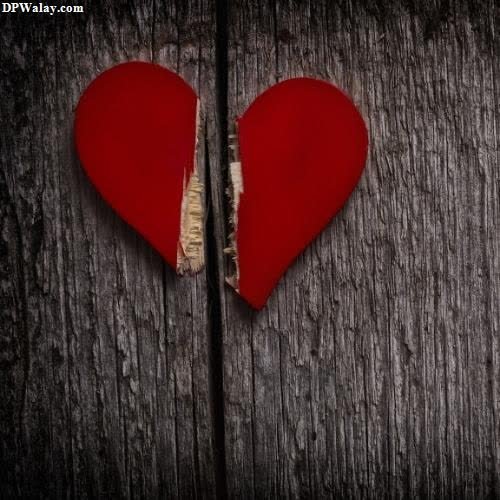 mood off dp - a broken heart on a wooden background