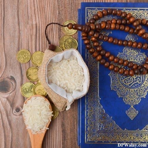 a rosary and a book on a wooden table