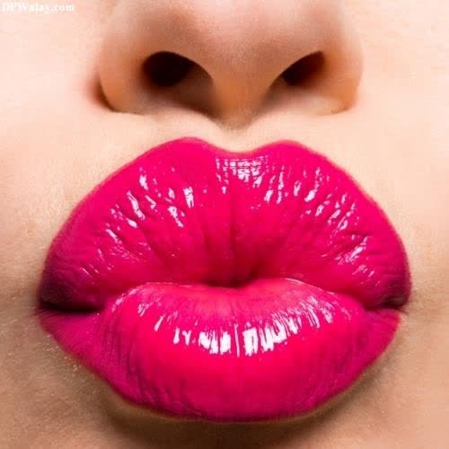 a woman with bright pink lipstick on her lips 