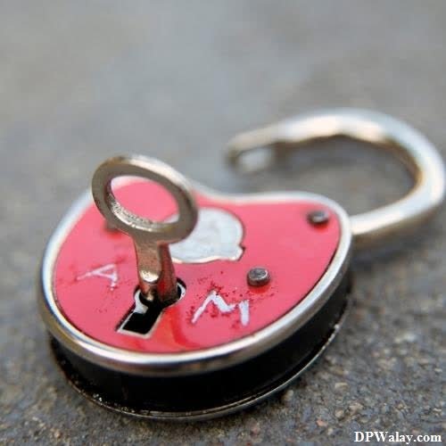 a heart shaped keychai with a keychai attached to it pic for dp girl 