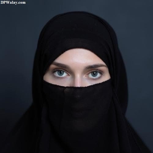 a woman wearing a black veil