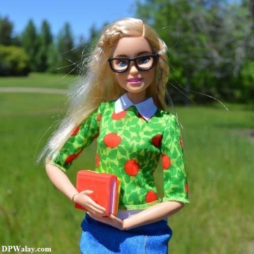 a doll with glasses and a book in her hand