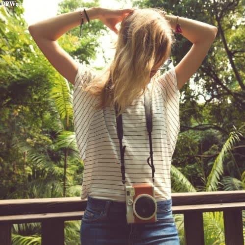 unique trendy dp for instagram - a woman standing on a deck with her hands on her head