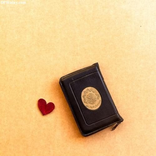 a small black wallet with a red heart on it profile islamic whatsapp dp
